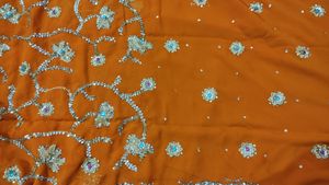 embroidered heavy orange saree
