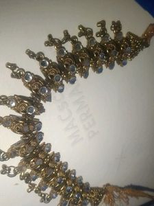 a golden colour necklace