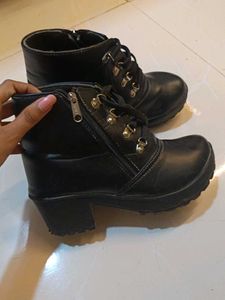 Ankle length zip closure black boots