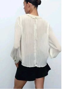 Top With Faux Pearl Detail At The Neck