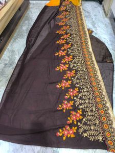 Yellow and brown new saree with intact blouse piec