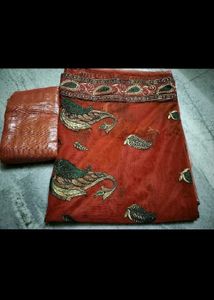 unusedElegant Orange Paisley Saree