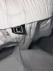White Straight Pant With Embroidery Work At Bottom