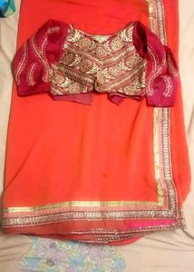 Orange Saree with Embroidered Blouse