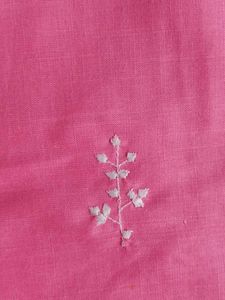 Traditional pink kurti with white embroidery.