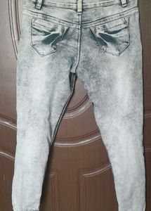 light grey, acid-wash or faded jeans.