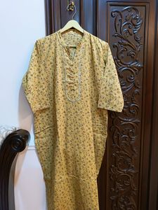 Yellow kurta with a delicate, small floral Print.