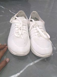 white sneakers.