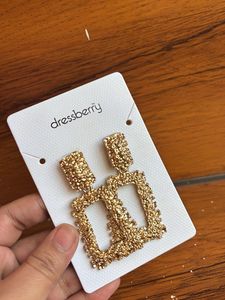 Gold toned textured geometric drop earrings