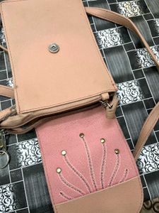 Elegant Pink Sling Bag with Embellished Sunburst
