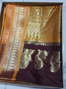 # Party Wear Maroon Silk Saree Golden Border.
