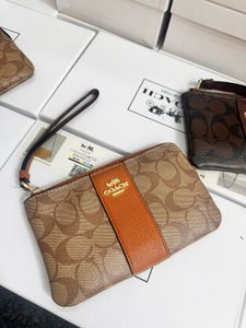 Coach Wristlet- Any 1