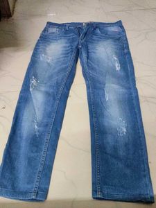 Distressed Blue Denim Jeans