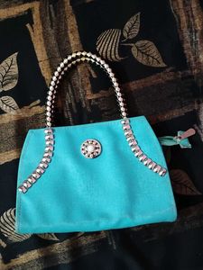 Teal Handbag with Embellishments