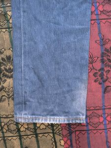 Worn Blue Denim Jeans