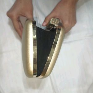 Golden Clutch Bag With Chain Sling Attachment