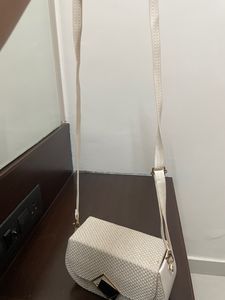 Beige sling bag