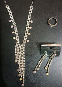 silver nacklace with ear ring and ring only one time Used