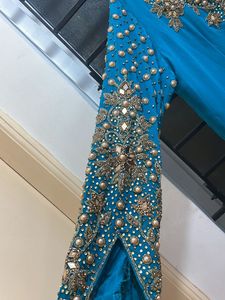 Elegant Teal Indian Outfit with Gold Stone