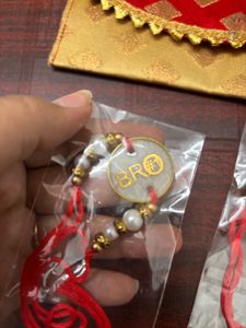 Pack Of 2 Resin Rakhi With A Money Holder