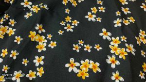 Black dress with yellow n white flowers
