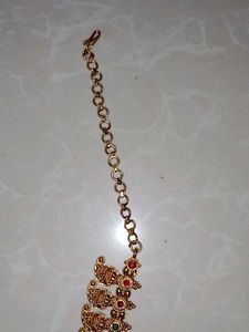Elegant Gold-Toned Necklace with Red Stone Pendant