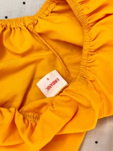 yellow crop top