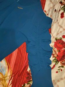 Elegant Blue Top with Detailed Sleeves