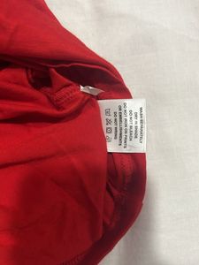 a red drape top