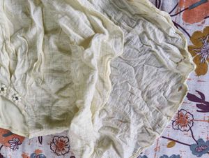 Ruffled Top with Neckline Embellishment