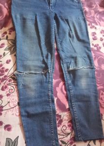 Fadded Damaged Blue Jeans