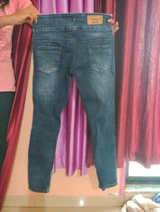 Ripped High-Waisted Denim Jeans