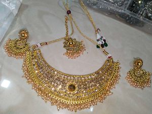 Golden Colour Choker With Earring Pair And Tika