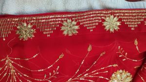 Radiant Red Saree with Intricate Gold Sequins