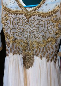 Elegant cream Anarkali set, with beautiful sequence embroidery and border