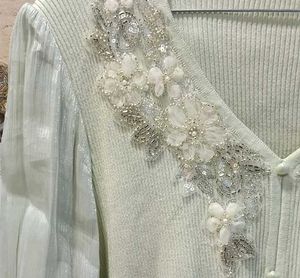 mint green knit top with embroidery