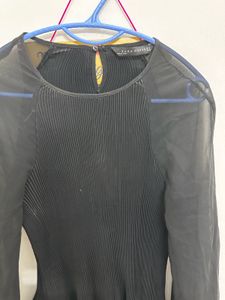 chic black pleated sheer top