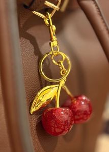COACH DUPE RED CHERRY CHARM KEYCHAIN