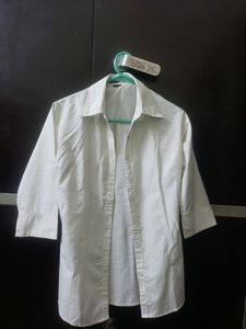 combo of white shirt and charcoal jeans