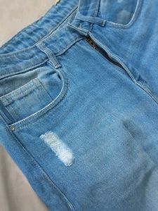 Mid Rise Ripped Denim Jeans