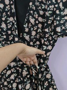 a black floral tie up dress