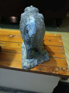white metal elephant figurine.