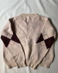 Cream knit V neck argyle sweater