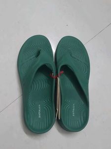 Branded Green flip-flops