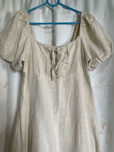 puff-sleeve cream midi dress