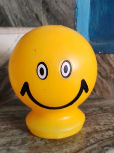 A Small Yellow Smiley Piggy Bank