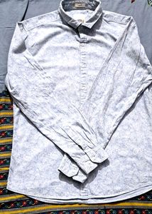 Branded printed leaf print shirt.