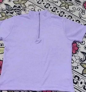 A light purple, body-fitting crop top