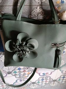 Elegant Green Handbag with Floral Detail