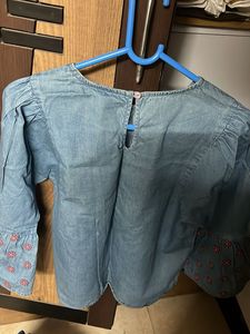 a top which is hardly worn, with bell sleeves